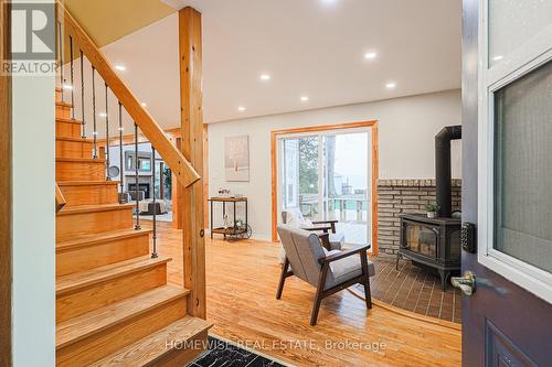 128 Moores Beach Road, Georgina (Virginia), ON - Indoor Photo Showing Other Room With Fireplace