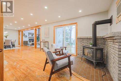 128 Moores Beach Road, Georgina (Virginia), ON - Indoor Photo Showing Living Room With Fireplace