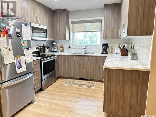 669 Dieppe Drive, Weyburn, SK - Indoor Photo Showing Kitchen With Double Sink