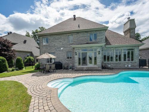 Back facade - 574 Rue Des Fortifications, Saint-Jean-Sur-Richelieu, QC - Outdoor With In Ground Pool