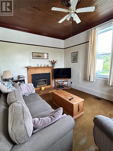 24-26 Caribou Road, Port Aux Basques, NL - Indoor Photo Showing Living Room With Fireplace