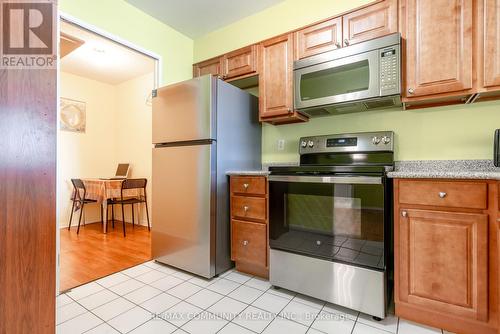 211 - 480 Mclevin Avenue, Toronto E11, ON - Indoor Photo Showing Kitchen