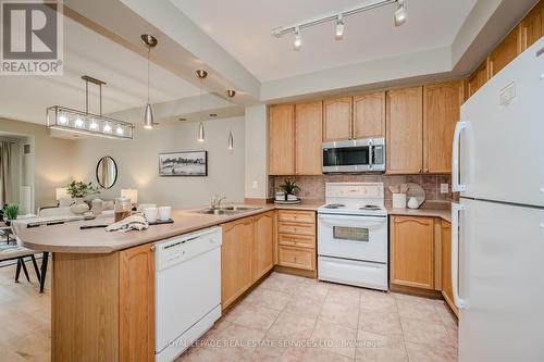 302 - 80 Port Street E, Mississauga (Port Credit), ON - Indoor Photo Showing Kitchen With Double Sink