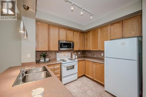302 - 80 Port Street E, Mississauga, ON - Indoor Photo Showing Kitchen With Double Sink