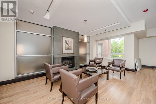302 - 80 Port Street E, Mississauga, ON - Indoor With Fireplace