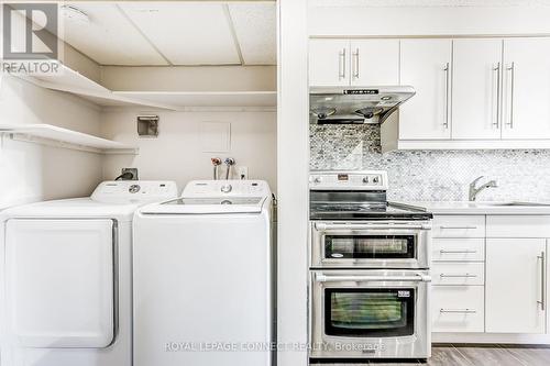 1211 - 90 Ling Road, Toronto, ON - Indoor Photo Showing Laundry Room