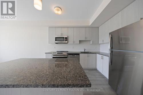 318 - 2550 Castlegate Crossing Drive, Pickering (Duffin Heights), ON - Indoor Photo Showing Kitchen With Stainless Steel Kitchen