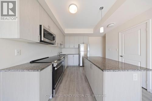 318 - 2550 Castlegate Crossing Drive, Pickering (Duffin Heights), ON - Indoor Photo Showing Kitchen With Stainless Steel Kitchen With Upgraded Kitchen