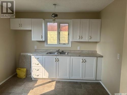 504 Cook Crescent S, La Ronge, SK - Indoor Photo Showing Kitchen With Double Sink