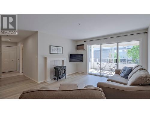 920 Argyle Street Unit# 203, Penticton, BC - Indoor Photo Showing Living Room With Fireplace