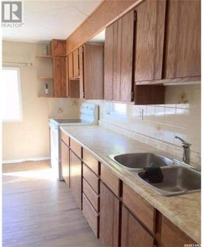 218 2Nd Avenue E, Rosetown, SK - Indoor Photo Showing Kitchen With Double Sink