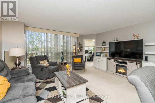 #202 - 330 Mill Street, Brampton, ON - Indoor Photo Showing Living Room With Fireplace