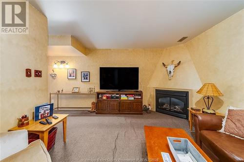 77 Crosswinds, Kingsville, ON - Indoor Photo Showing Living Room With Fireplace