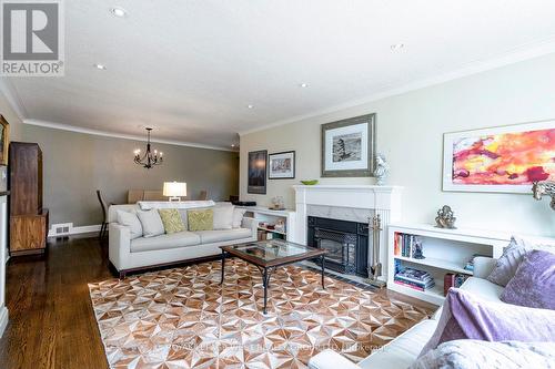 12 Kirk Bradden Road E, Toronto (Stonegate-Queensway), ON - Indoor Photo Showing Living Room With Fireplace