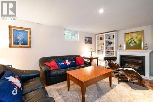 12 Kirk Bradden Road E, Toronto (Stonegate-Queensway), ON - Indoor Photo Showing Living Room With Fireplace