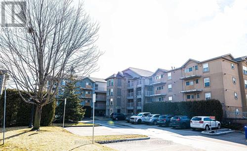 306 - 1450 Bishops Gate, Oakville (Glen Abbey), ON - Outdoor With Balcony With Facade