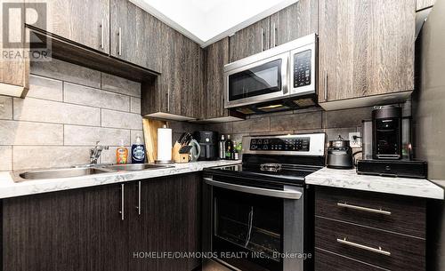 306 - 1450 Bishops Gate, Oakville (Glen Abbey), ON - Indoor Photo Showing Kitchen With Double Sink