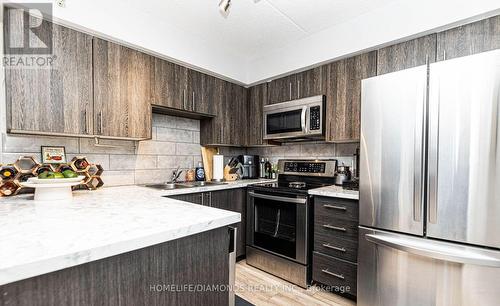 306 - 1450 Bishops Gate, Oakville (Glen Abbey), ON - Indoor Photo Showing Kitchen With Double Sink