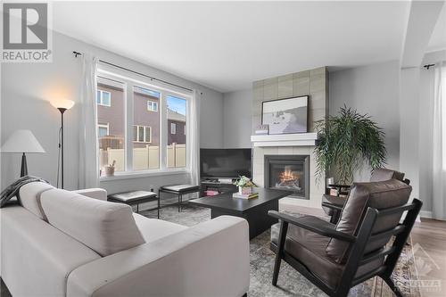 802 Cappamore Drive, Ottawa, ON - Indoor Photo Showing Living Room With Fireplace