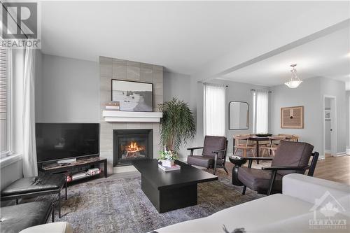 802 Cappamore Drive, Ottawa, ON - Indoor Photo Showing Living Room With Fireplace