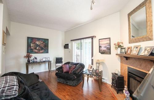 445 Stone Church Road W|Unit #15, Hamilton, ON - Indoor Photo Showing Living Room With Fireplace