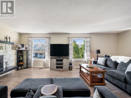 6992 Longacre Drive, Vernon, BC - Indoor Photo Showing Living Room With Fireplace