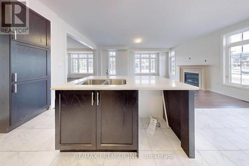 2 Jadite Street, Whitby, ON - Indoor Photo Showing Kitchen With Fireplace With Double Sink