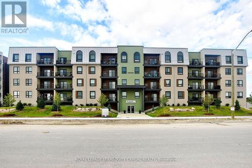 212 - 6 Spice Way, Barrie, ON - Outdoor With Balcony With Facade