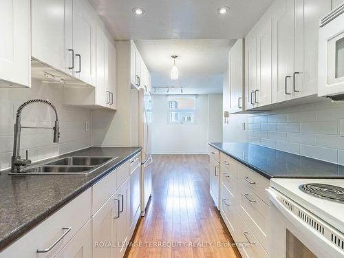 703-299 Mill Rd, Toronto, ON - Indoor Photo Showing Kitchen With Double Sink