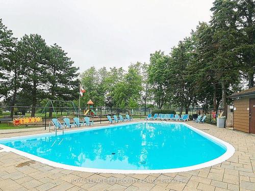 703-299 Mill Rd, Toronto, ON - Outdoor With In Ground Pool With Backyard