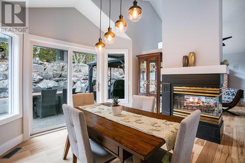 4172 Gallaghers Grove, Kelowna, BC - Indoor Photo Showing Dining Room With Fireplace