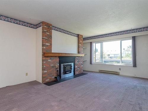 205-2286 Henry Ave, Sidney, BC - Indoor Photo Showing Other Room With Fireplace