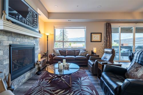 206-3255 Okanagan Street, Armstrong, BC - Indoor Photo Showing Living Room With Fireplace