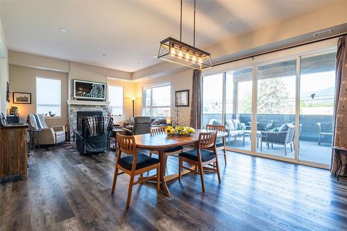 206-3255 Okanagan Street, Armstrong, BC - Indoor Photo Showing Dining Room With Fireplace