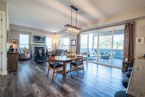 206-3255 Okanagan Street, Armstrong, BC - Indoor Photo Showing Dining Room With Fireplace