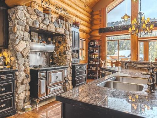 2439 Fairways Drive, Kamloops, BC - Indoor Photo Showing Kitchen With Fireplace With Double Sink