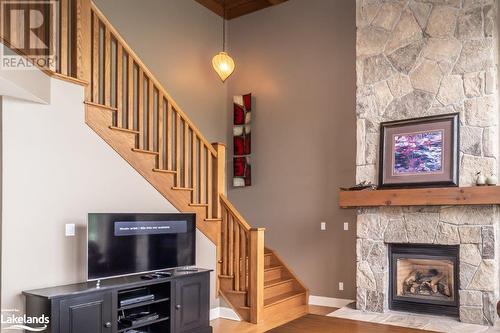 3876 Muskoka 118 Road Unit# Sandfield 6 W5, Port Carling, ON - Indoor Photo Showing Living Room With Fireplace