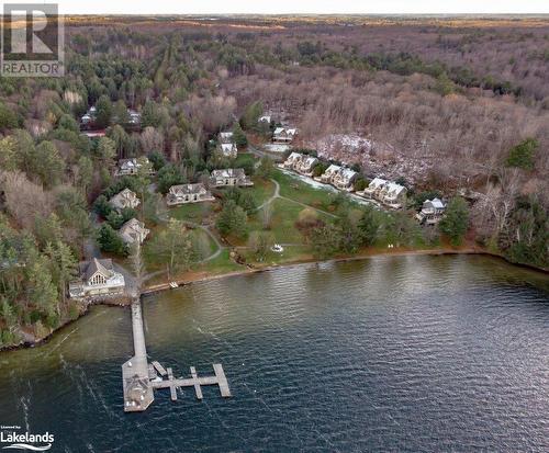 Aerial of resort - 3876 Muskoka 118 Road Unit# Sandfield 6 W5, Port Carling, ON - Outdoor With Body Of Water With View