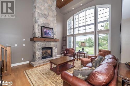 3876 Muskoka 118 Road Unit# Sandfield 6 W5, Port Carling, ON - Indoor Photo Showing Living Room With Fireplace