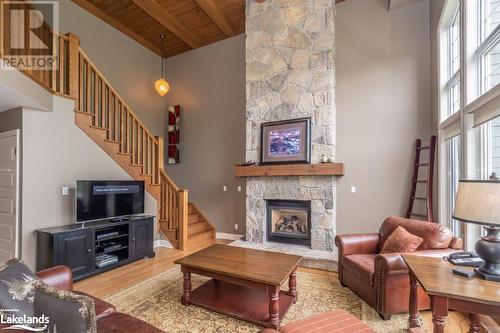 3876 Muskoka 118 Road Unit# Sandfield 6 W5, Port Carling, ON - Indoor Photo Showing Living Room With Fireplace