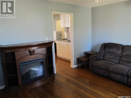 302 Carbon Avenue, Bienfait, SK - Indoor Photo Showing Living Room With Fireplace