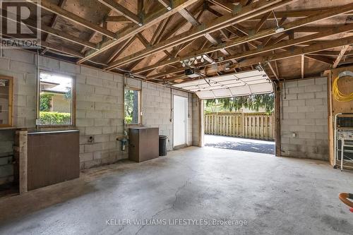 Garage w 2 sandpoint wells for watering the yard - 39 Oneida Road, London, ON - Indoor Photo Showing Basement