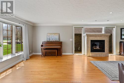 21430 Lynn Drive, Wheatley, ON - Indoor Photo Showing Living Room With Fireplace