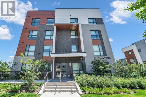 312 - 50 Kaitting Trail, Oakville, ON - Outdoor With Facade