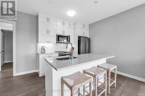 312 - 50 Kaitting Trail, Oakville, ON - Indoor Photo Showing Kitchen