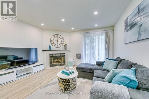 1114 - 95 Trailwood Drive, Mississauga, ON - Indoor Photo Showing Living Room With Fireplace