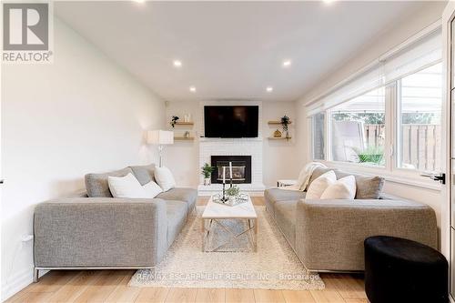 12 Cheval Drive, Grimsby, ON - Indoor Photo Showing Living Room With Fireplace