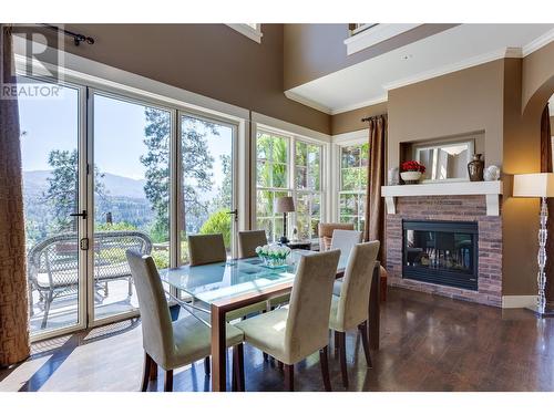 965 Westpoint Drive, Kelowna, BC - Indoor Photo Showing Dining Room With Fireplace