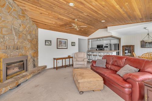 209-4340B Beach Avenue, Peachland, BC - Indoor Photo Showing Living Room With Fireplace