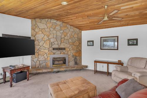 209-4340B Beach Avenue, Peachland, BC - Indoor Photo Showing Living Room With Fireplace